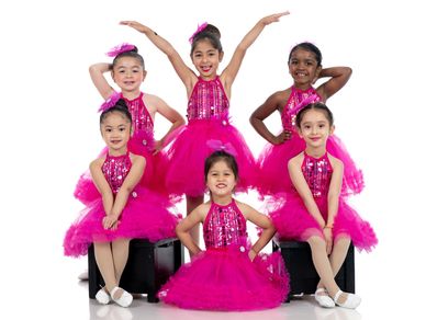 Group portrait of young ballerinas wearing Pink performance outfits

