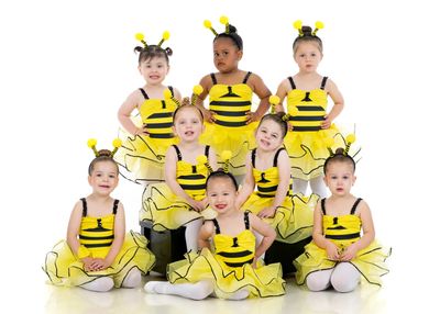 A group of little girl perform on the stage