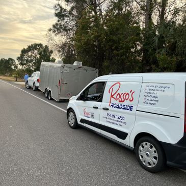 Rosso's Roadside van parked behind a trailer on a road.