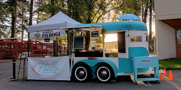Catering trailer and tent setup at Kootenai County Farmers Market for pierogi with flat top grill 