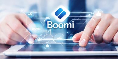Person interacting with a digital interface featuring the Boomi logo and icons.