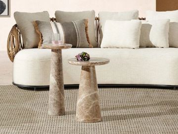 marble side tables with unique sculptural forms for modern living spaces