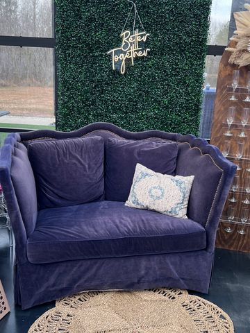 greenery wall neon sign and vintage navy velvet loveseat Statesboro Georgia party event planning and