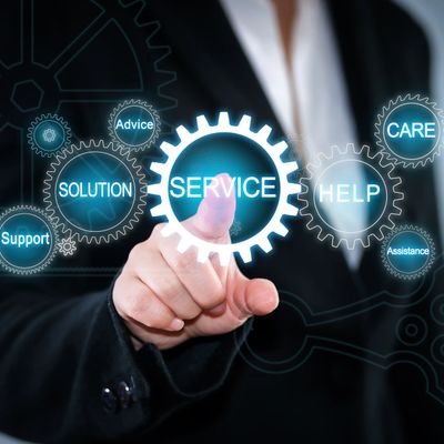 A finger clicking on a service cog, amongst other cogs showing support, solution, advice, help