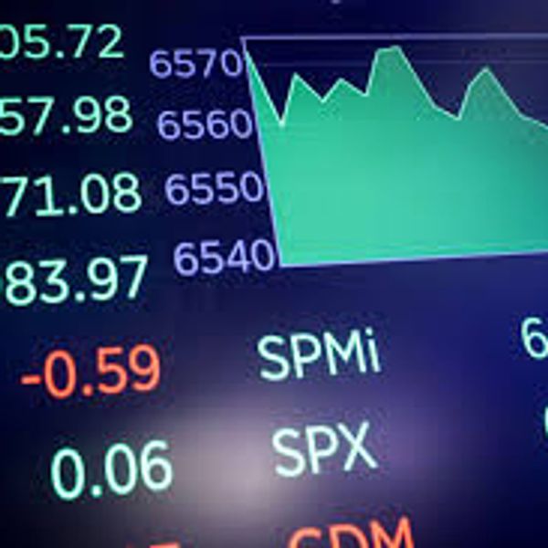 Stock market data with indexes and graph showing fluctuations.