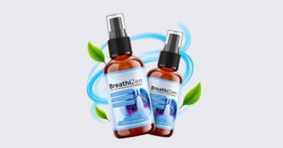 Two bottles of BreathZzen spray with fresh green leaves.