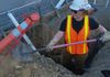 Digging water main connection.