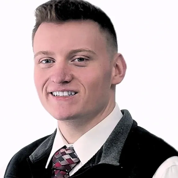 Portrait of a young man in formal attire.