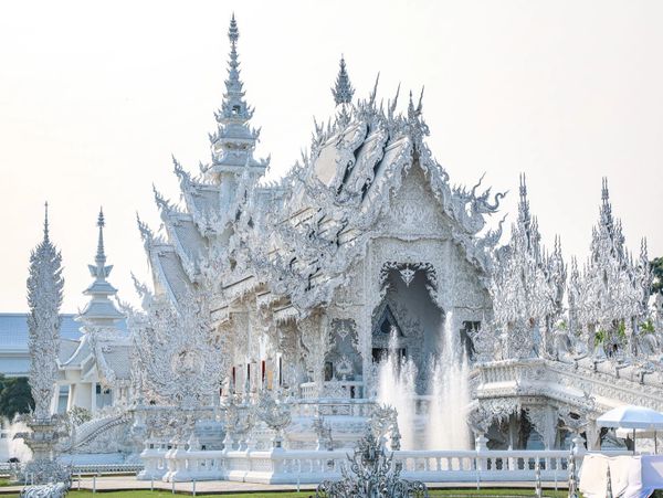 The White Temple with intricate carvings and fountains.