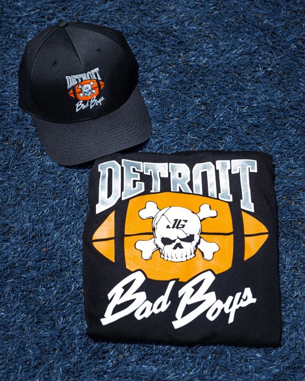 Detroit Bad Boys hat and t-shirt on blue turf.