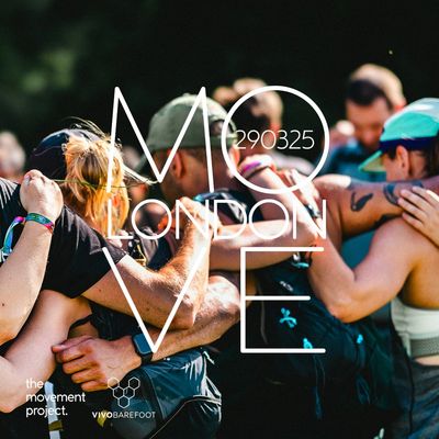Group hug at a MOVE London event promoting community and fitness.