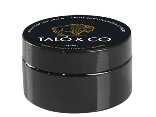 Black container of Taló & Co premium body cream with gold and white text.