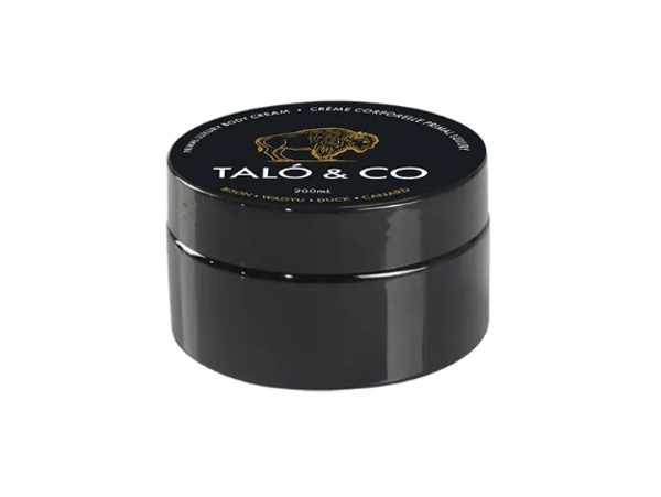 Black jar of Taló & Co body cream with gold buffalo logo and ingredients listed.