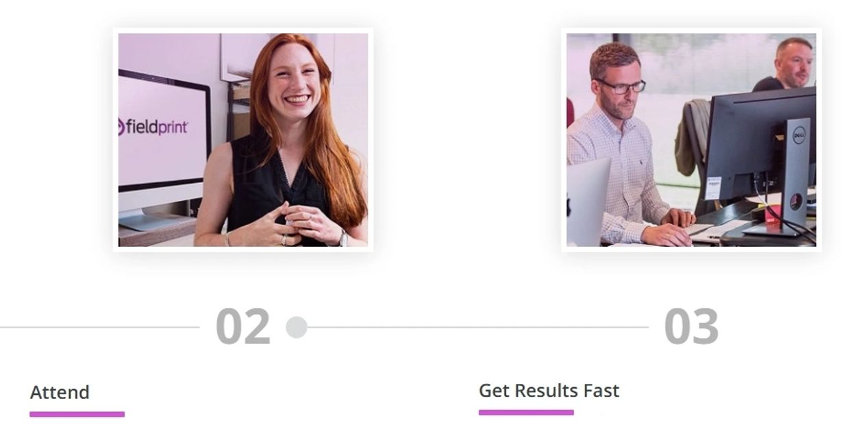Woman smiling and man working at a computer.