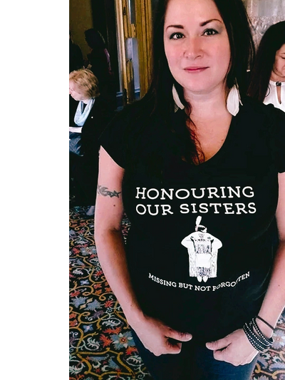 Crystal wearing a shirt that says "Honouring our Sisters: Missing but Not Forgotten."