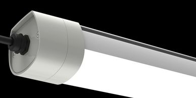 Close-up of a modern LED tube light with a black power cable.