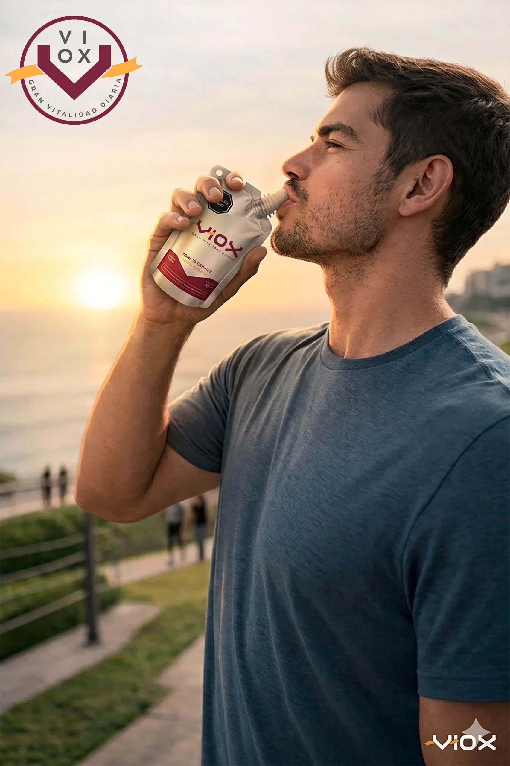 Man drinks Viox tonic pouch at sunset with a scenic background.