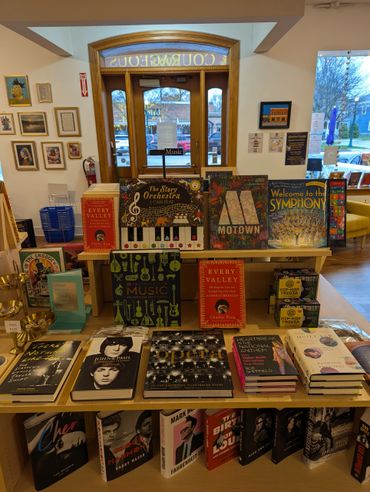 A bookstore display featuring music-related books and trivia games.