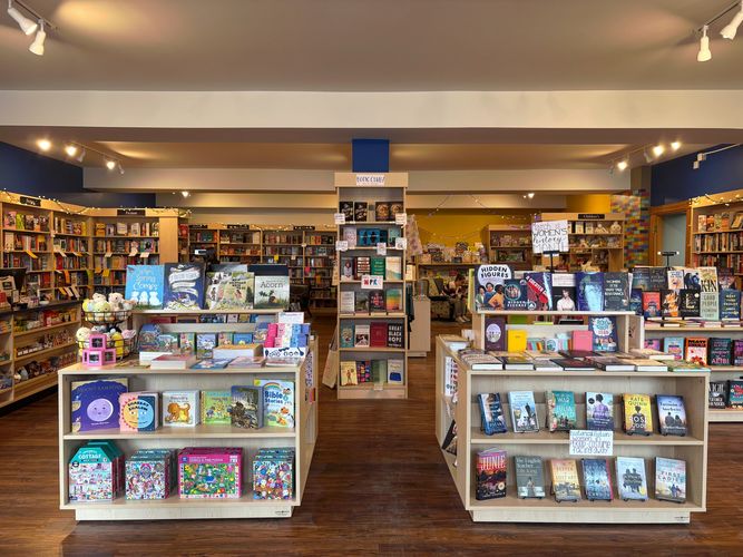 The front display at Courageous Books highlighting Women's History Month and a spring display with s