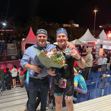 Leslie and Craig @ finish line of Barcelona Ironman