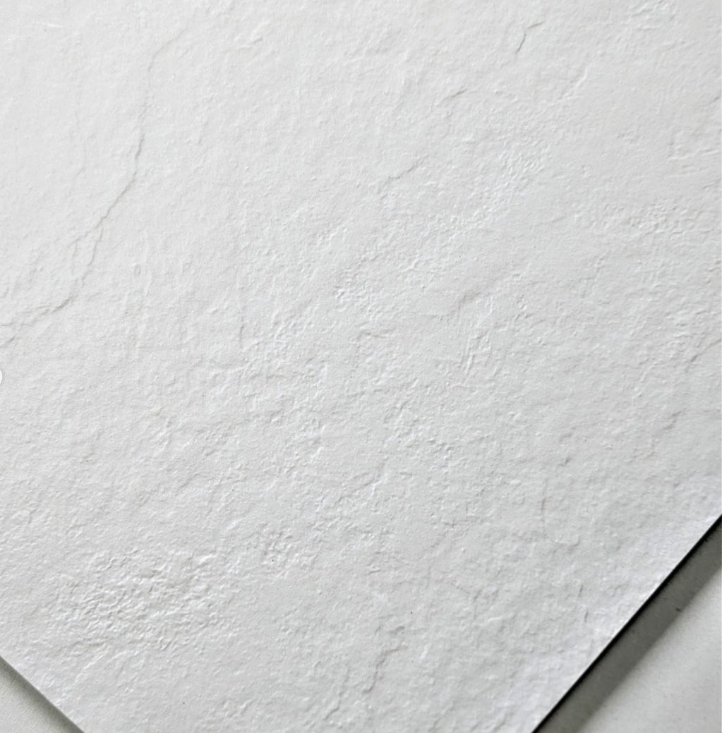 Close-up of textured white paper.