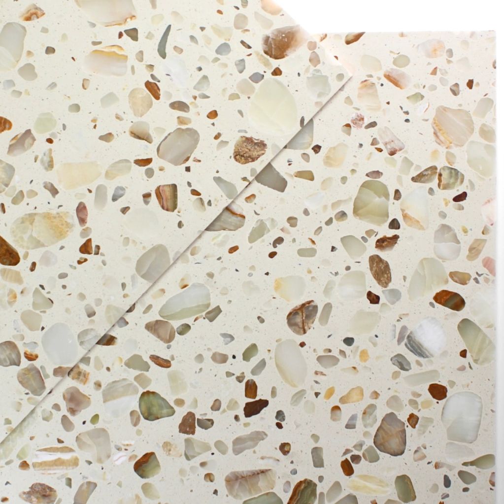 Close-up of terrazzo stone surface with mixed colored chips.