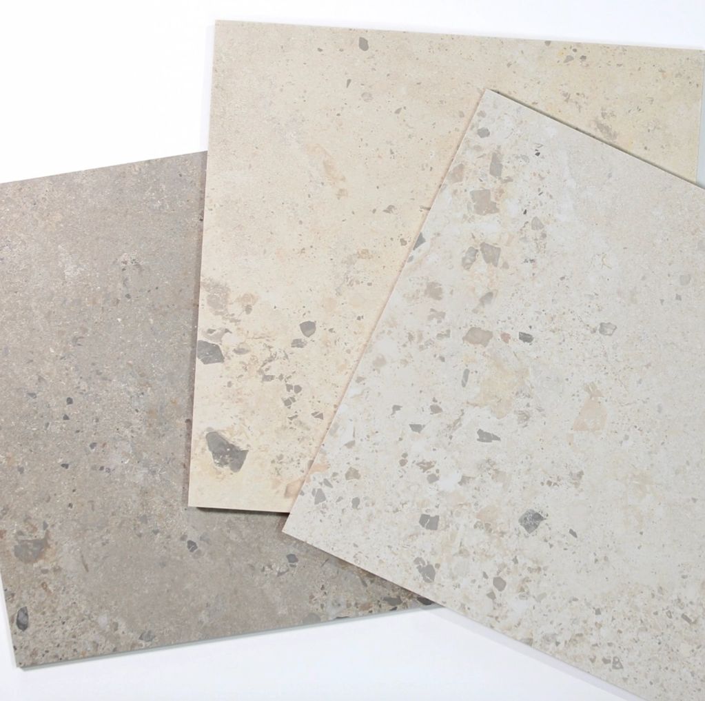 Three beige and gray terrazzo tiles.