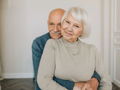 old couple holding each other