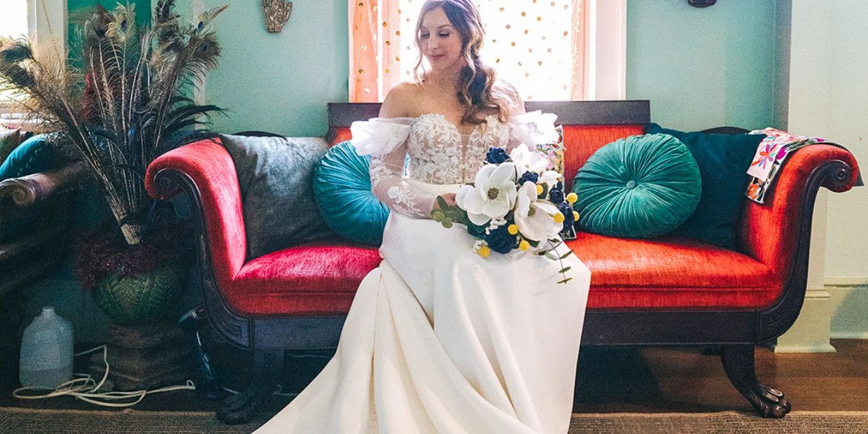 New Orleanss elopement bride relaxes prior to ceremony in hidden garden outside the French Quarter 