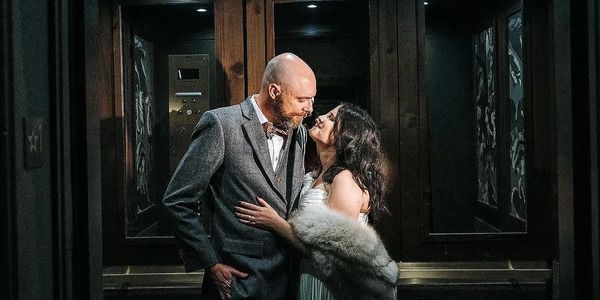 Newly married destination wwssing couple celebrates with a kiss post New Orleans wedding ceremony 