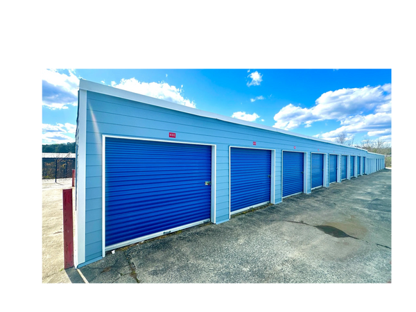 Row of self-storage units with blue doors for rent at American Mini Storage in Kennesaw, GA. 
