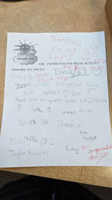 Thank you note with children's signatures for a solar activity.