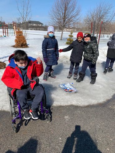 Children playing outside in winter.