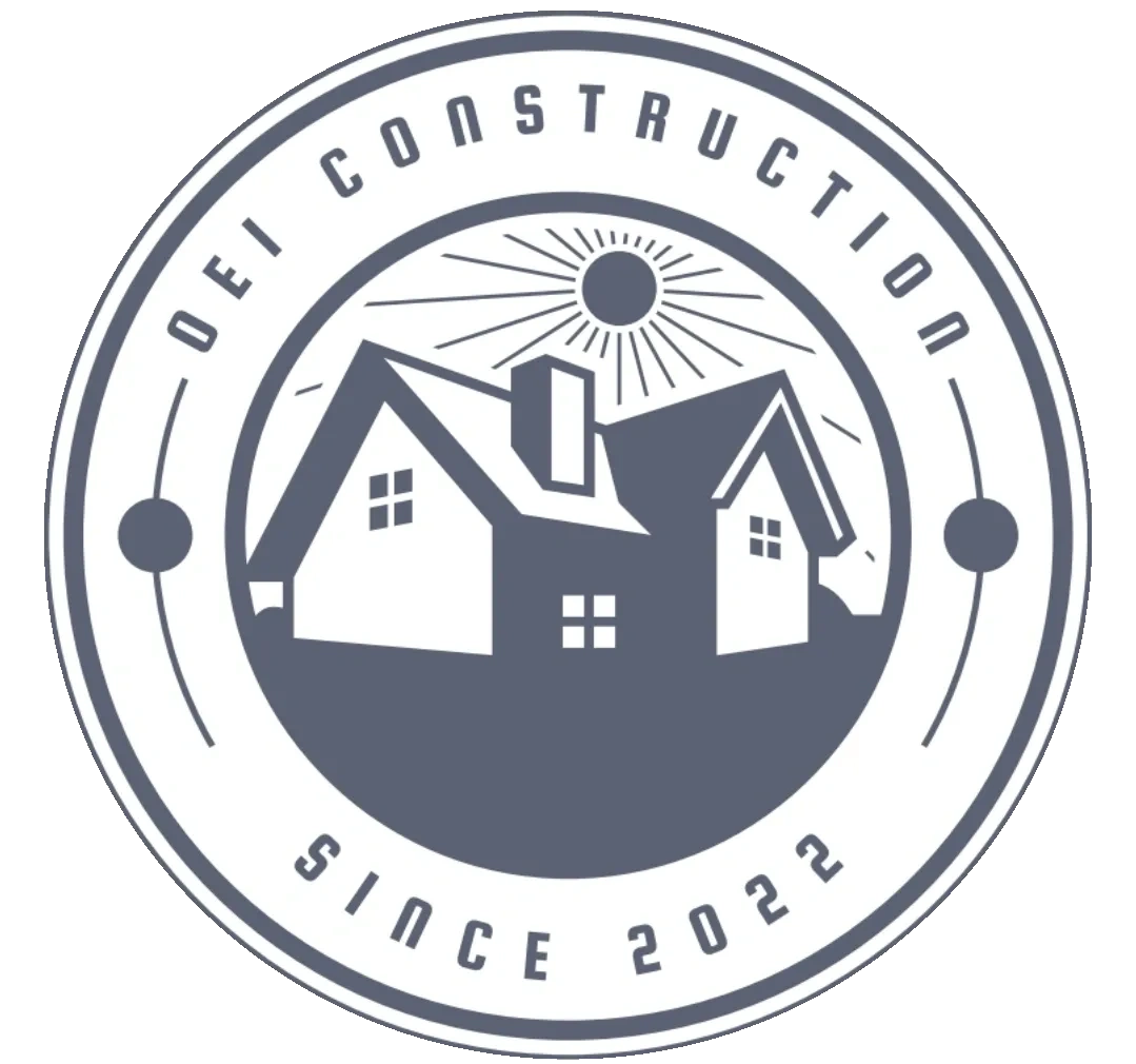 Logo of OEI Construction featuring a house and sun design.