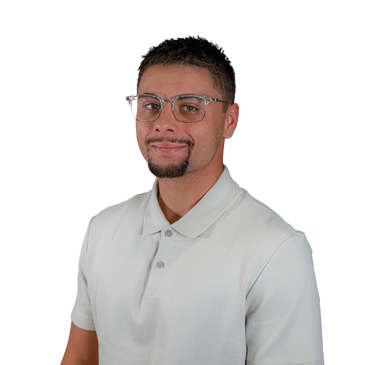 Man with glasses wearing a light-colored polo shirt smiling.
