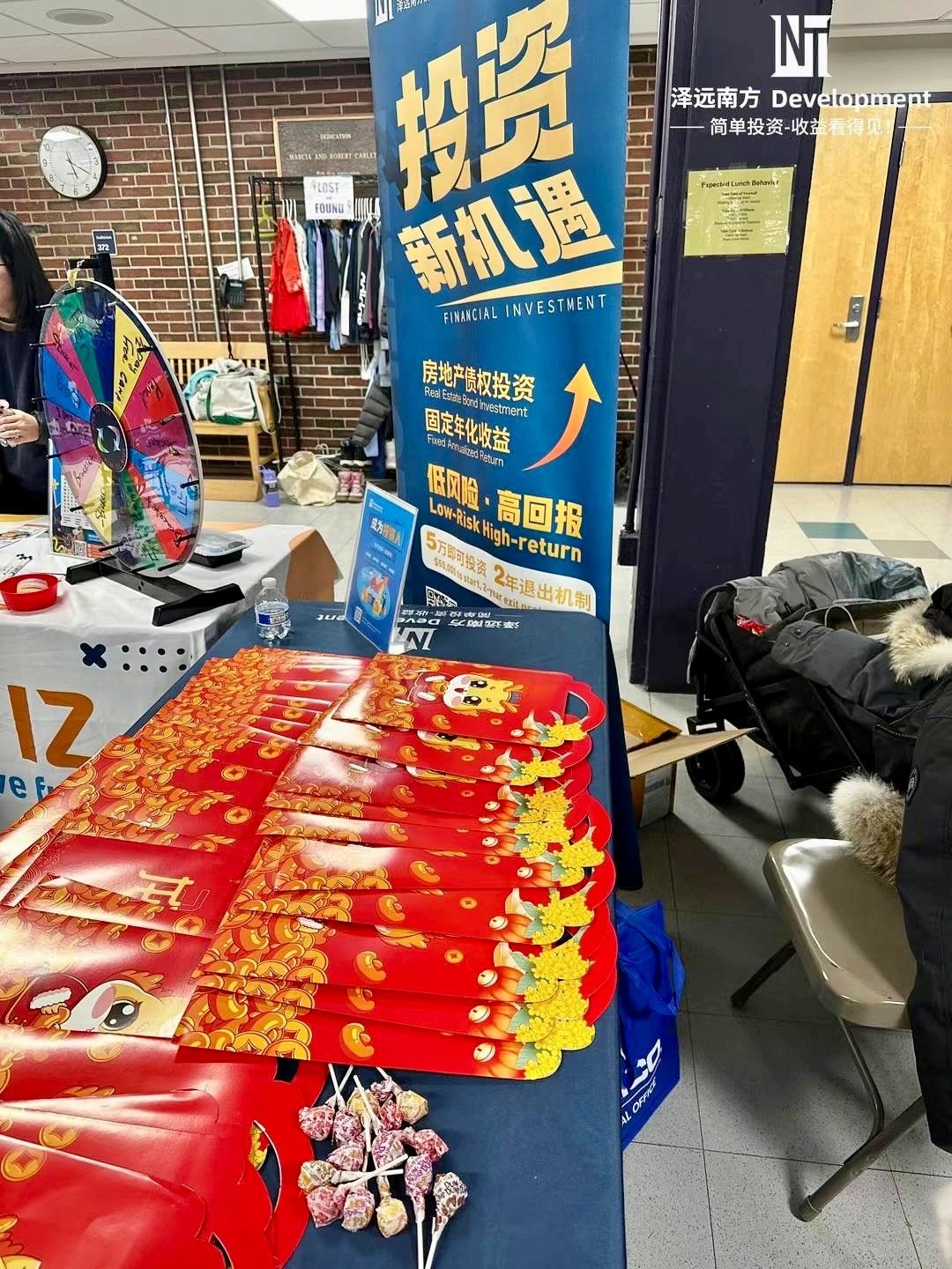 Financial investment booth with red envelopes and candy.