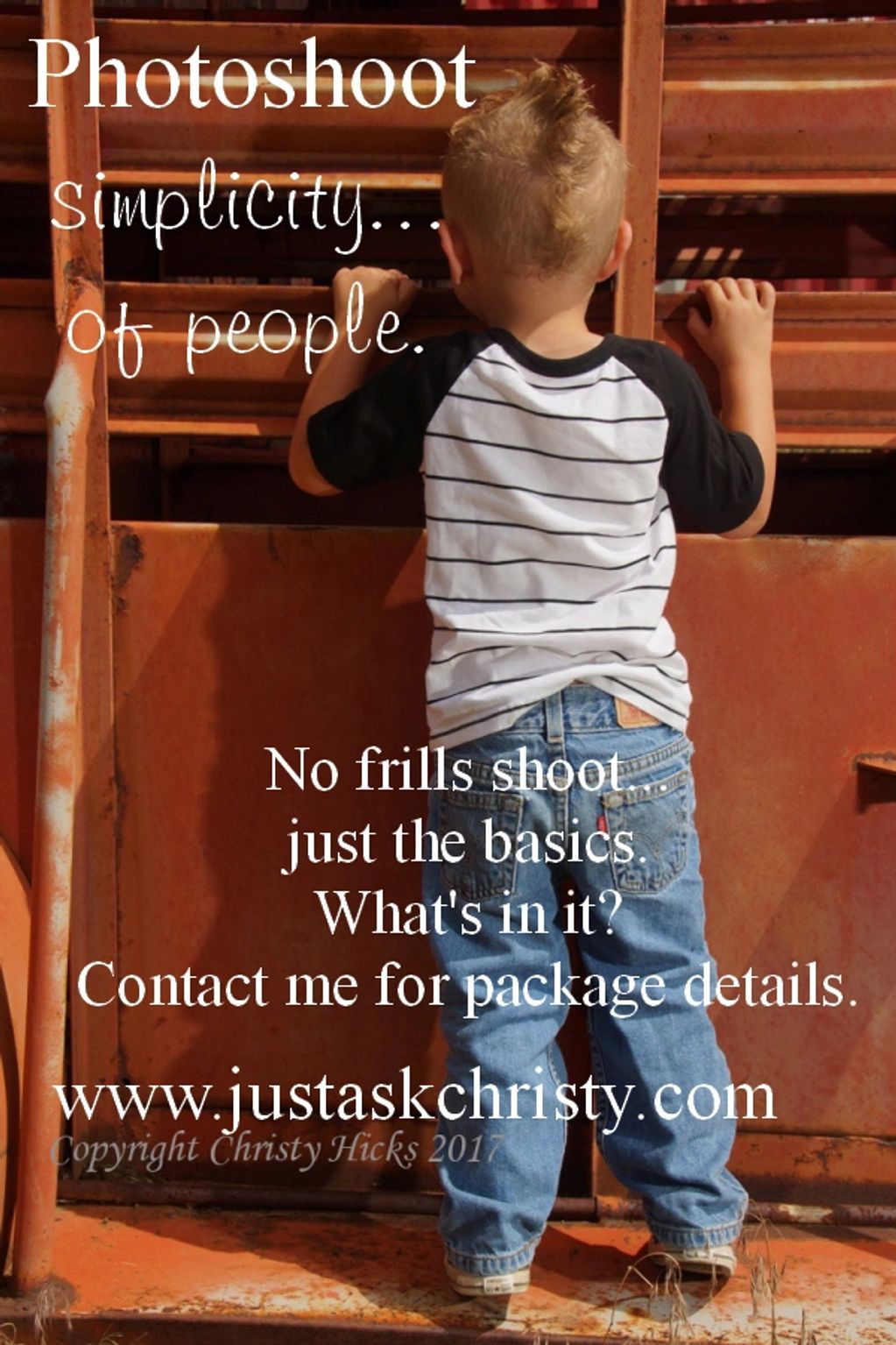 Boy peeking through the rails of a horse trailer.