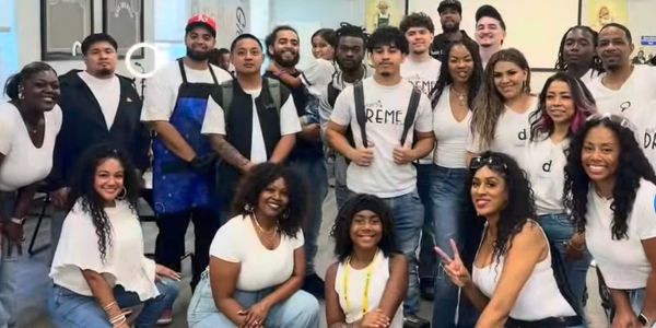Group of people posing together indoors.