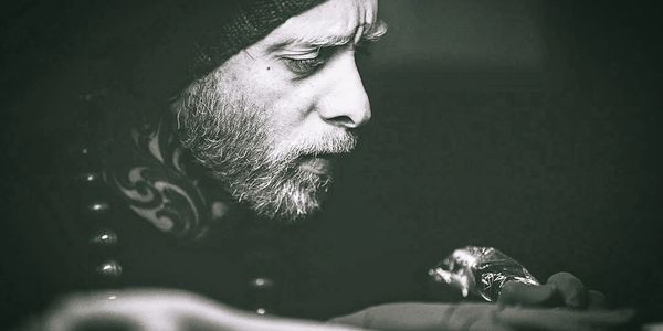 Man focused intensely on his work.