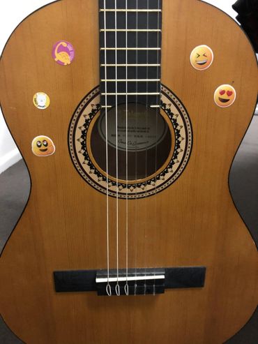Acoustic guitar with stickers