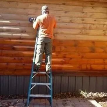 Bryan sanding log wall !