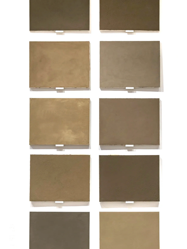 A 2x5 grid of soil paintings hanging on a white wall.