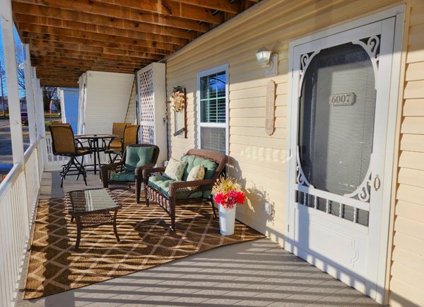 Enjoy the large covered patio and outdoor living space The Wine Porch Hideaway has to offer