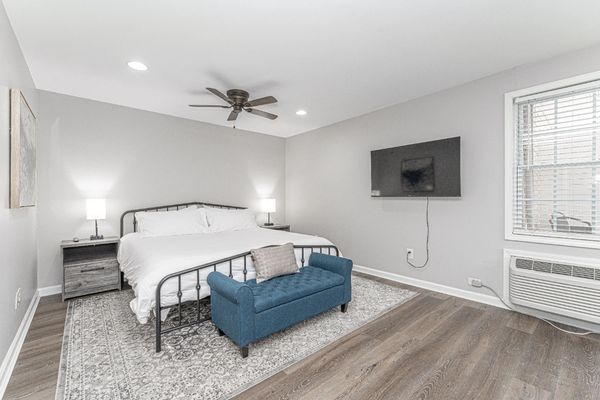 An interior photo featuring the king-sized bed in The Royale Room, a large studio apartment