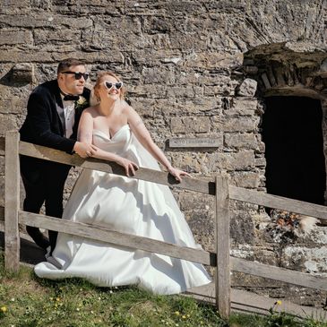 Candid wedding photography bride and groom wearing sunglasses at Wales castle elopement wedding