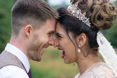 Wedding Photograph of bride and groom rubbing noses laughing wedding photography Laura Miller Wales