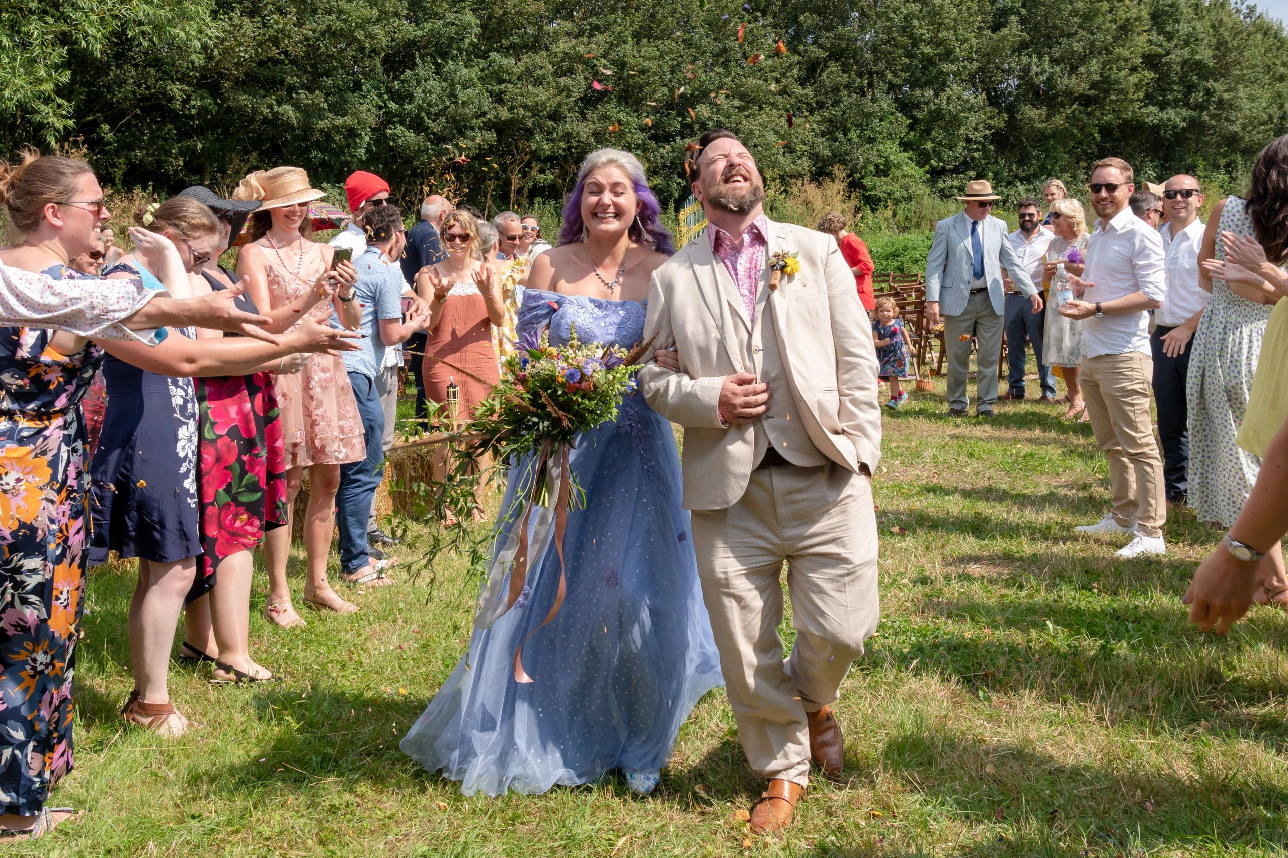 Photograph confetti thrown at Dorset wedding photo by Laura Miller Photography Wiltshire wedding 