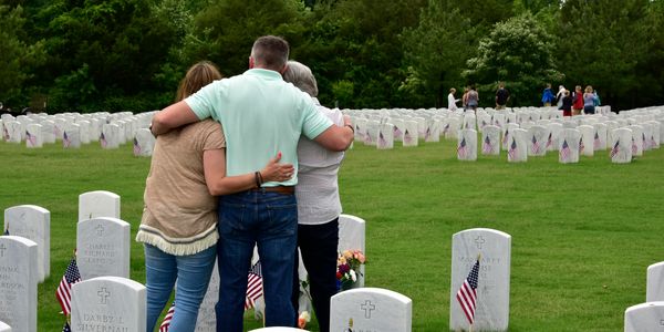 Memorial Day graveside flag placement - remembering our fallen and comforting their families. 