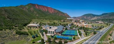 Drone photography of Glenwood Springs Recreation Center in the foreground with beautiful Red Mountai