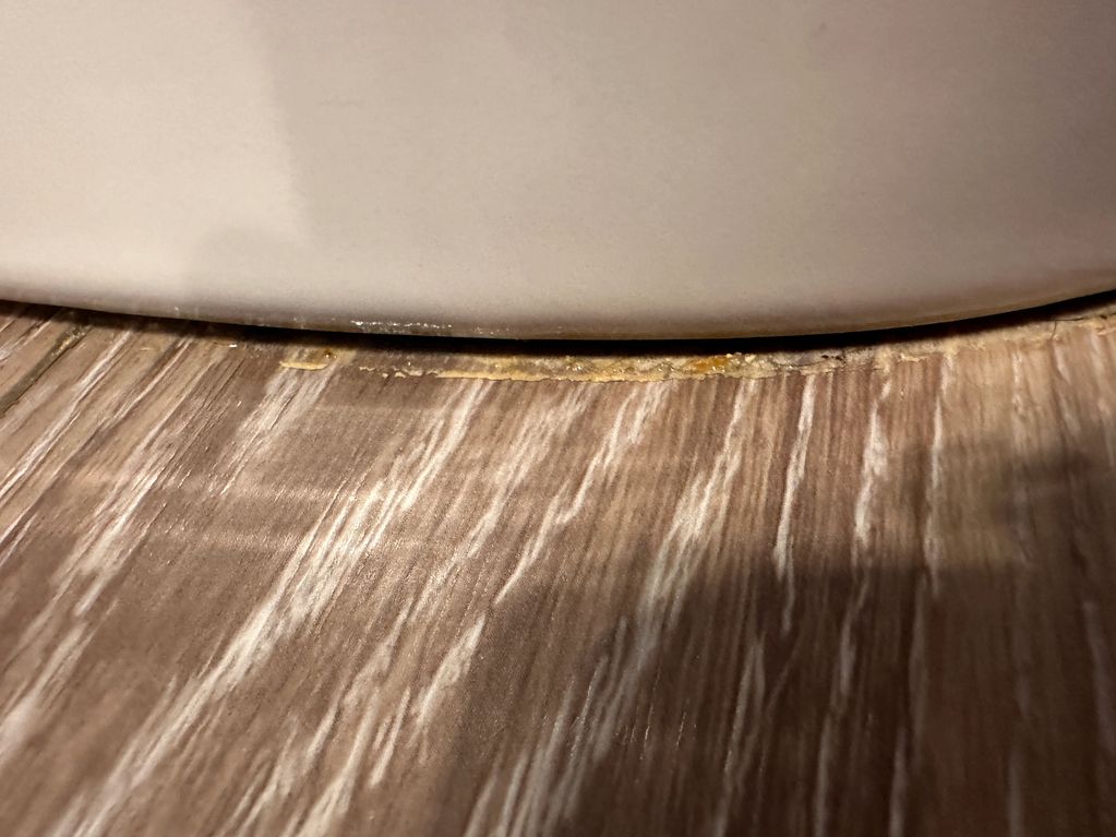 Crystalized Pee is very common in Boys bathrooms. If the caulk has failed it keeps it protected.